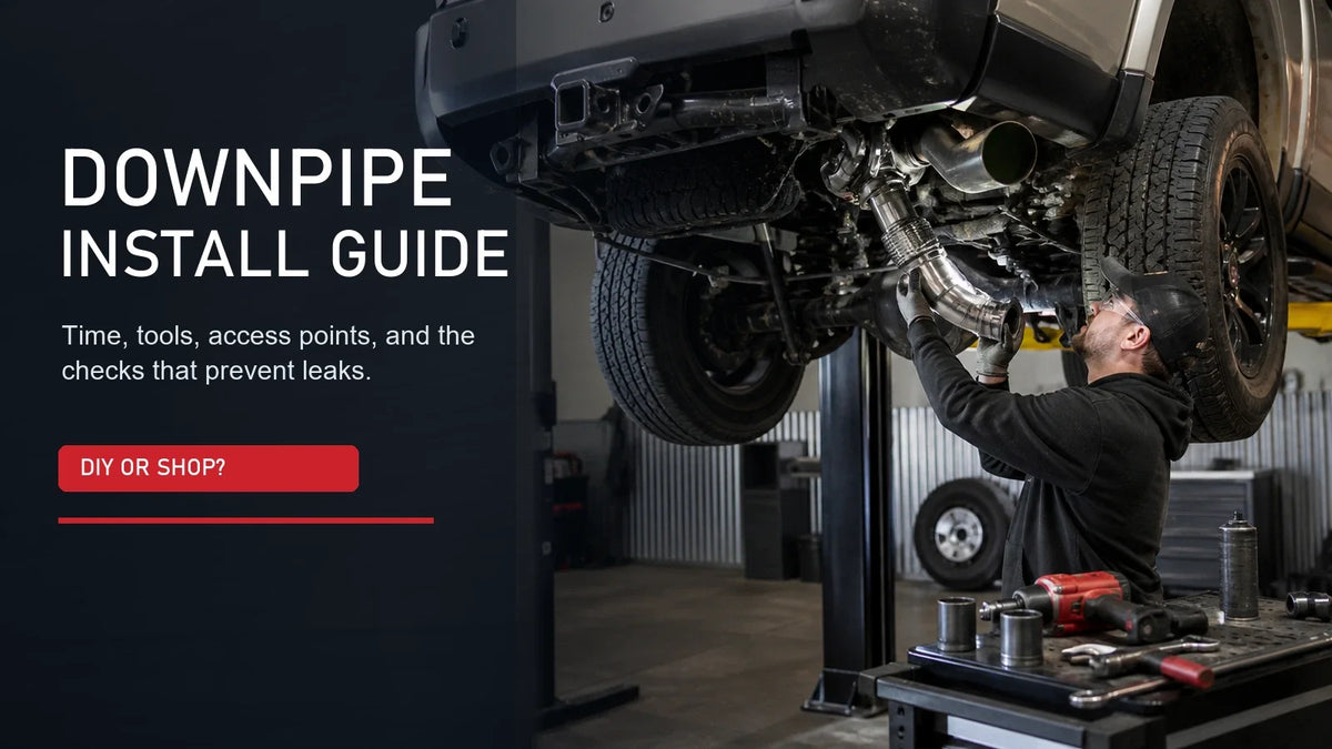 Downpipe install guide with mechanic fitting exhaust pipe under a lifted pickup truck