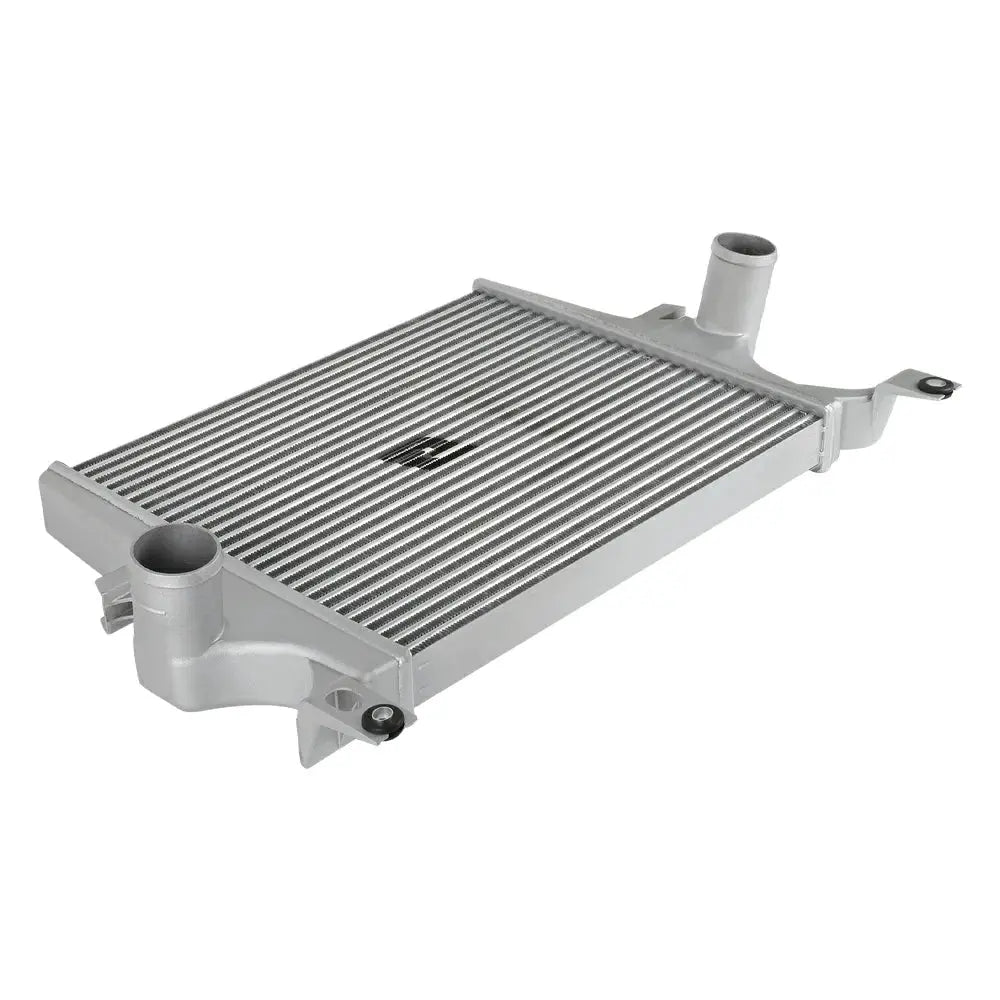 Isometric overhead view of a silver tube-fin intercooler with inlet and outlet ports for a Ford 6.0L Powerstroke
