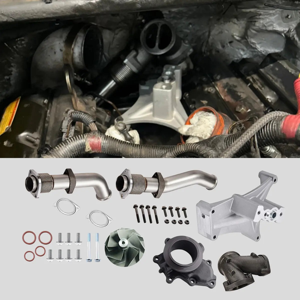 7.3 Powerstroke engine bay with the turbo pedestal installed, above bellowed up-pipes, Y-adapter, compressor wheel and hardware laid out